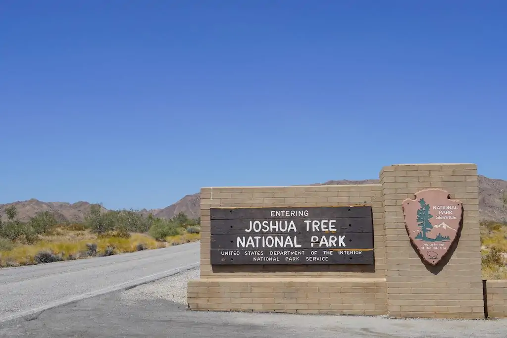 Joshua Tree National Park Entrance sign by the road.