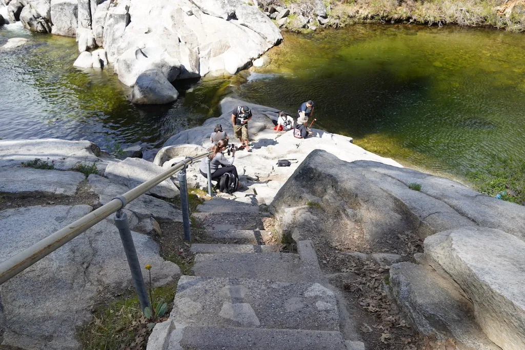 People are enjoying the view of the natural pool in Dinkey Creek.