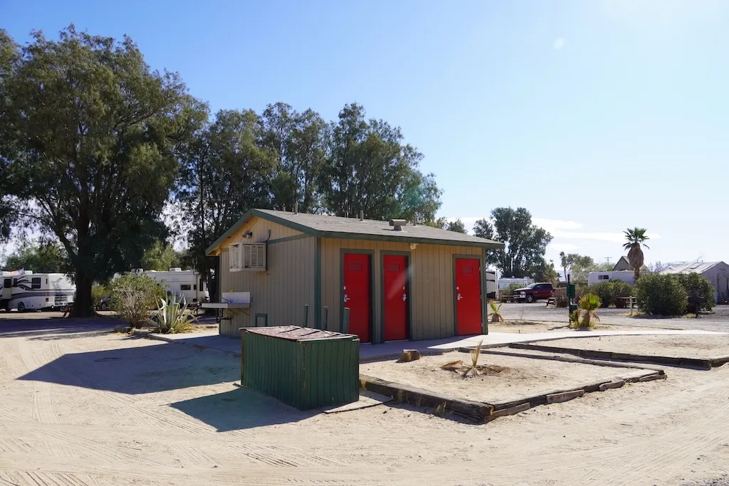 A restroom building with outside sink at KOA Barstow and Calico.
