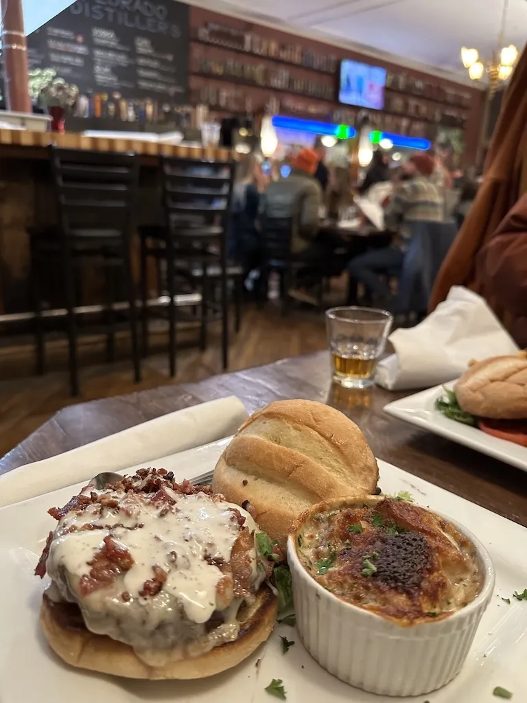 Juicy hamburger and onion soup on the plate at a sports bar style restaurant in Salida, Colorado.