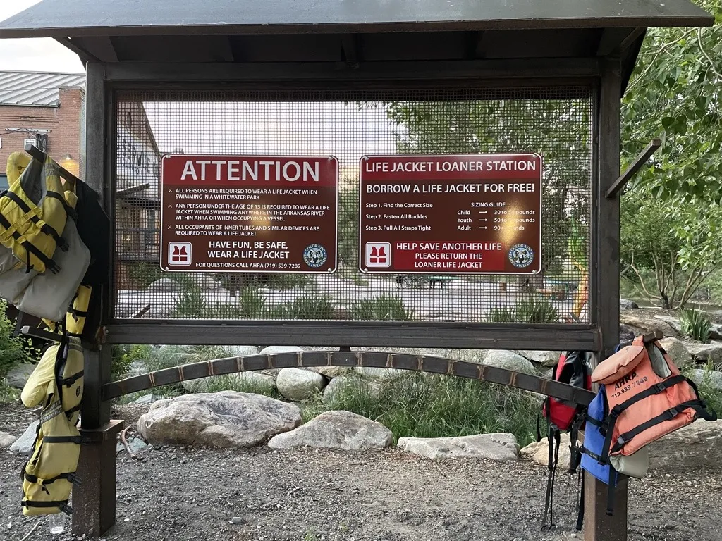 Life Jackets are on the bulletin board at riverside park in Salida, Colorado.