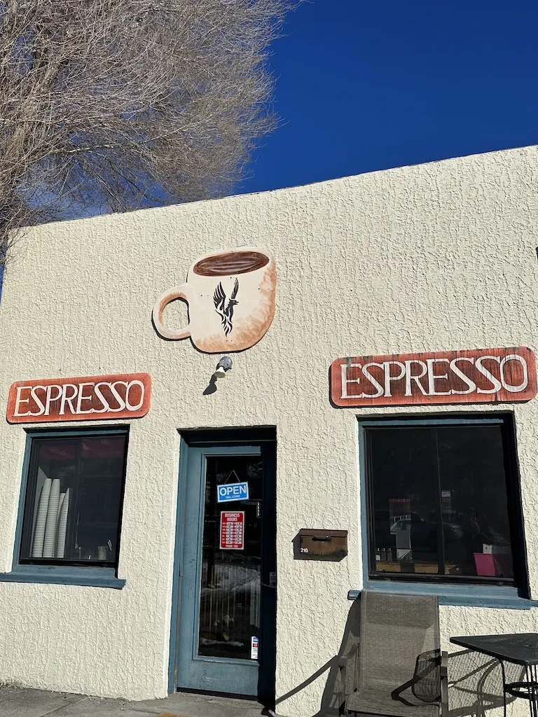 Coffee shop with sign of Espresso and coffee cup on the wall of the building.