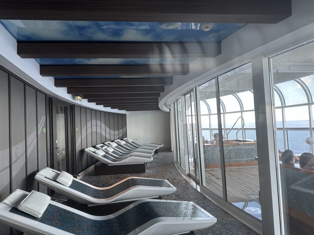 DCL Dream Hot Stone Chairs - Tomo Travel & Camping Hot stone chairs are in front of outdoor oceans for DCL guests.