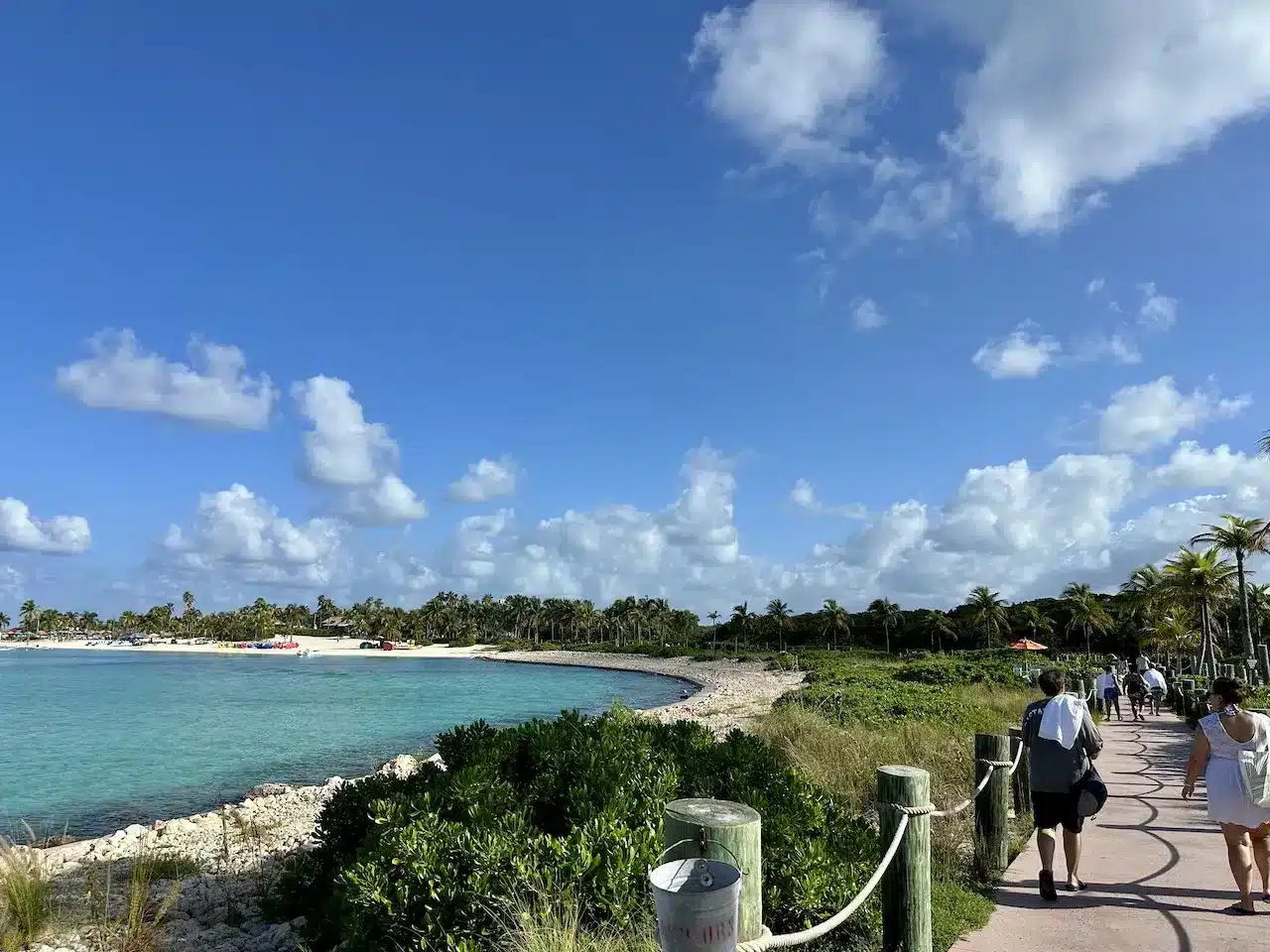 People walking on the path to family beach on Castaway Cay.
