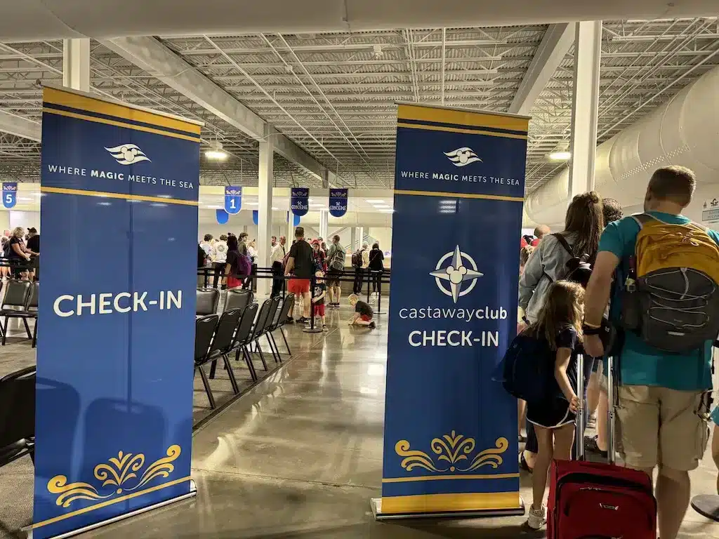 People are separated into the different check-in line based on their DCL membership status.