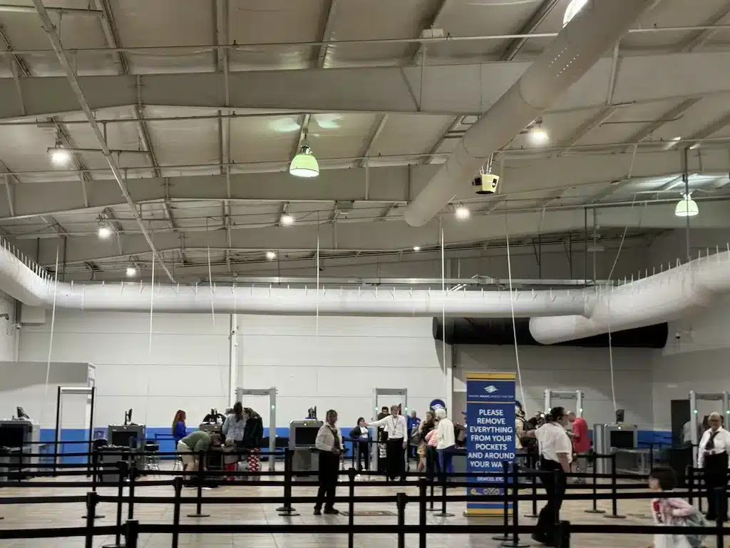 Staff are leading DCL guests to security line at Galveston Port.