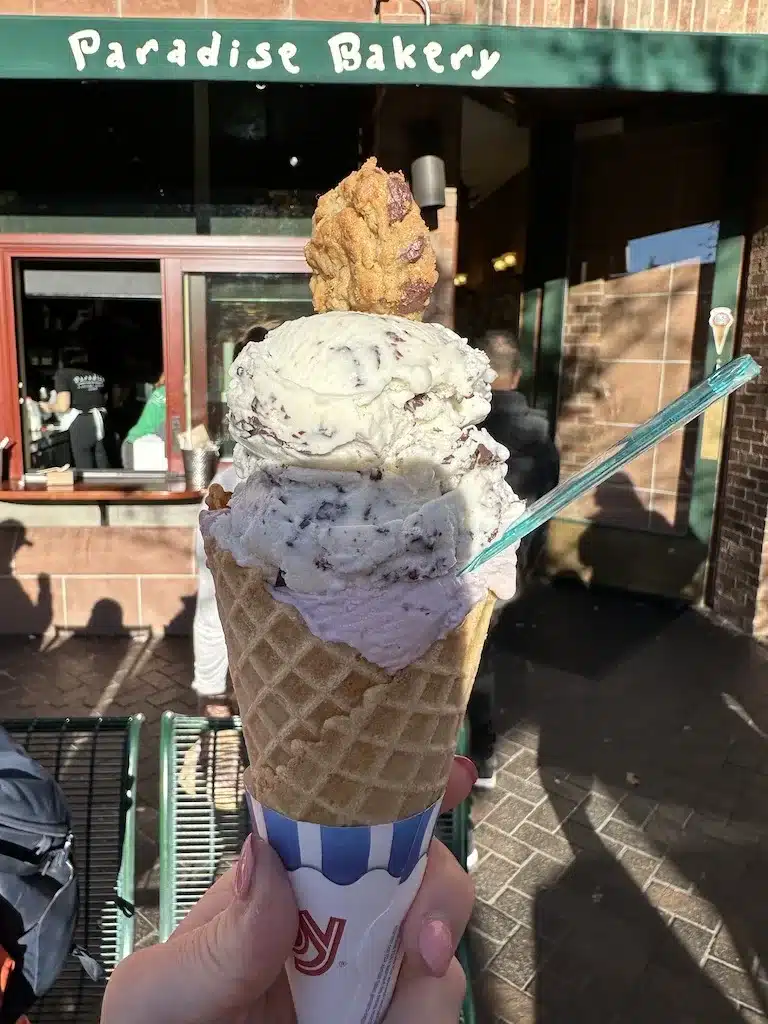 Delicious-looking double scoop of ice cream in a waffle cone.