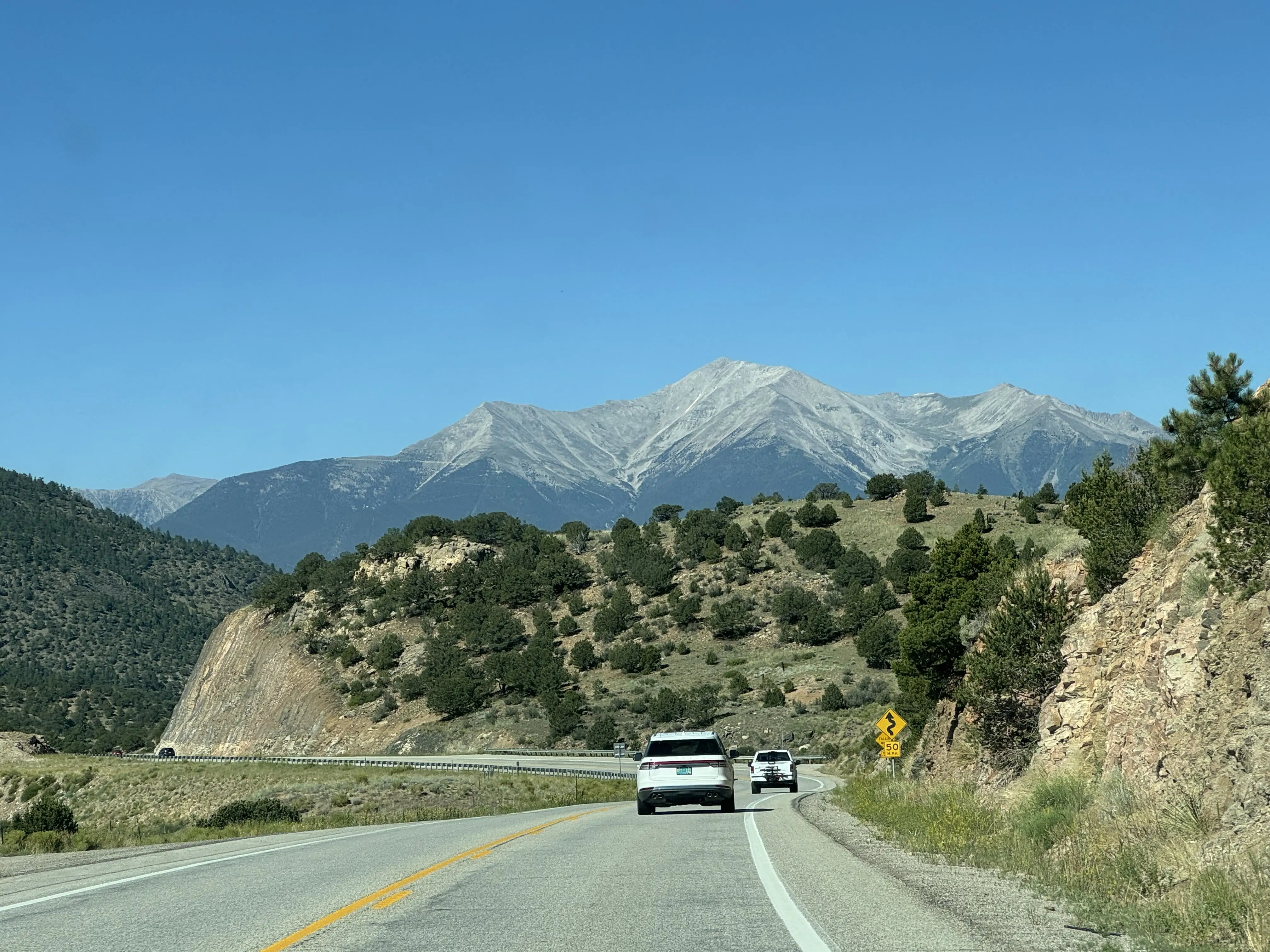 US-285: A Scenic Road with Mountains in Front