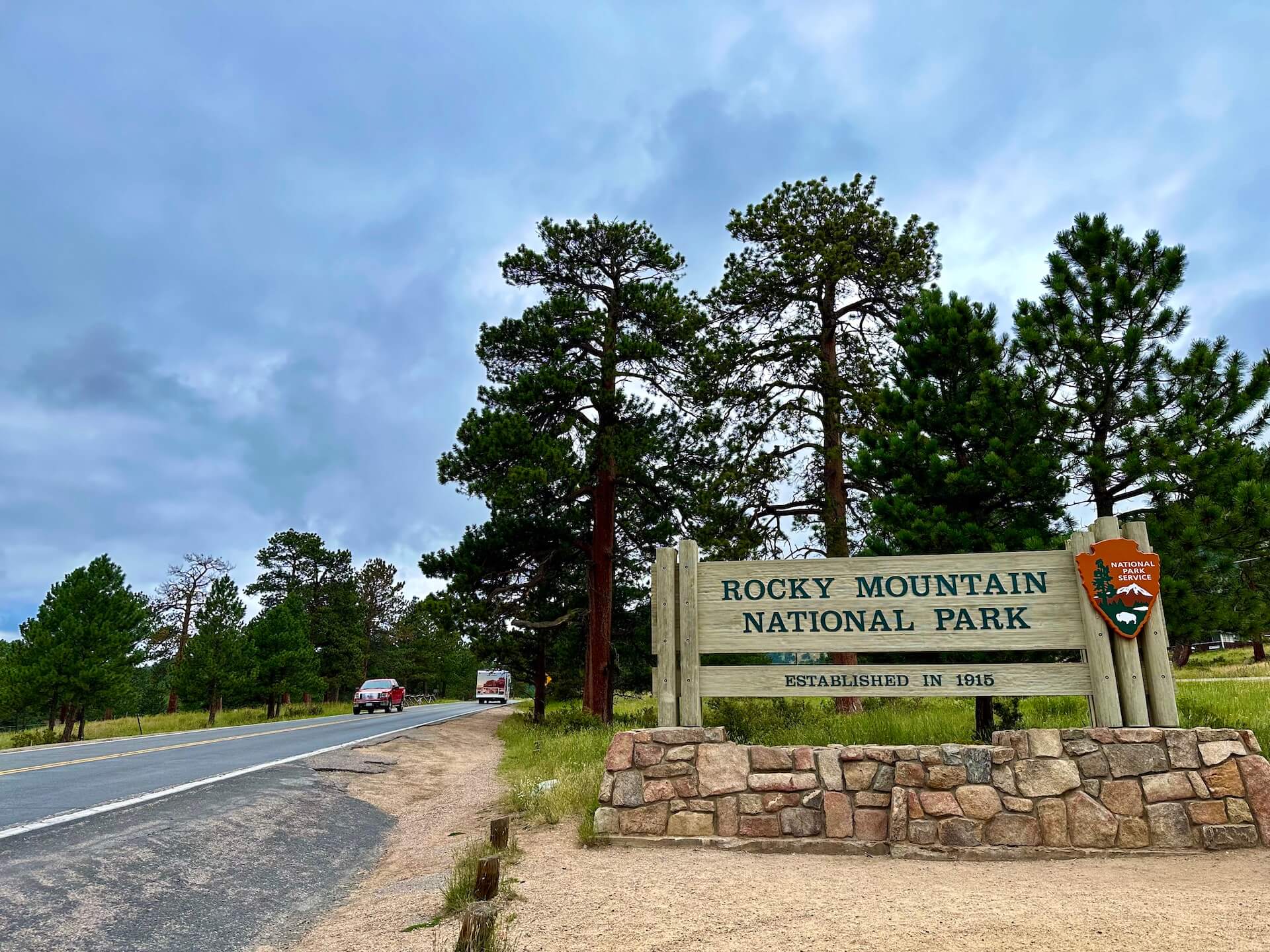 Wooden board sign of Rocky Mountain National Park