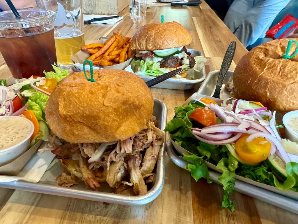 BBQ Pork sandwich and beef hamburger are on the table at Malts in Saratoga, Wyoming.