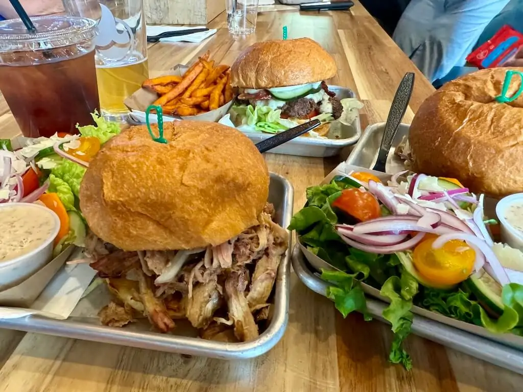 BBQ Pork sandwich and beef hamburger are on the table at Malts in Saratoga, Wyoming.