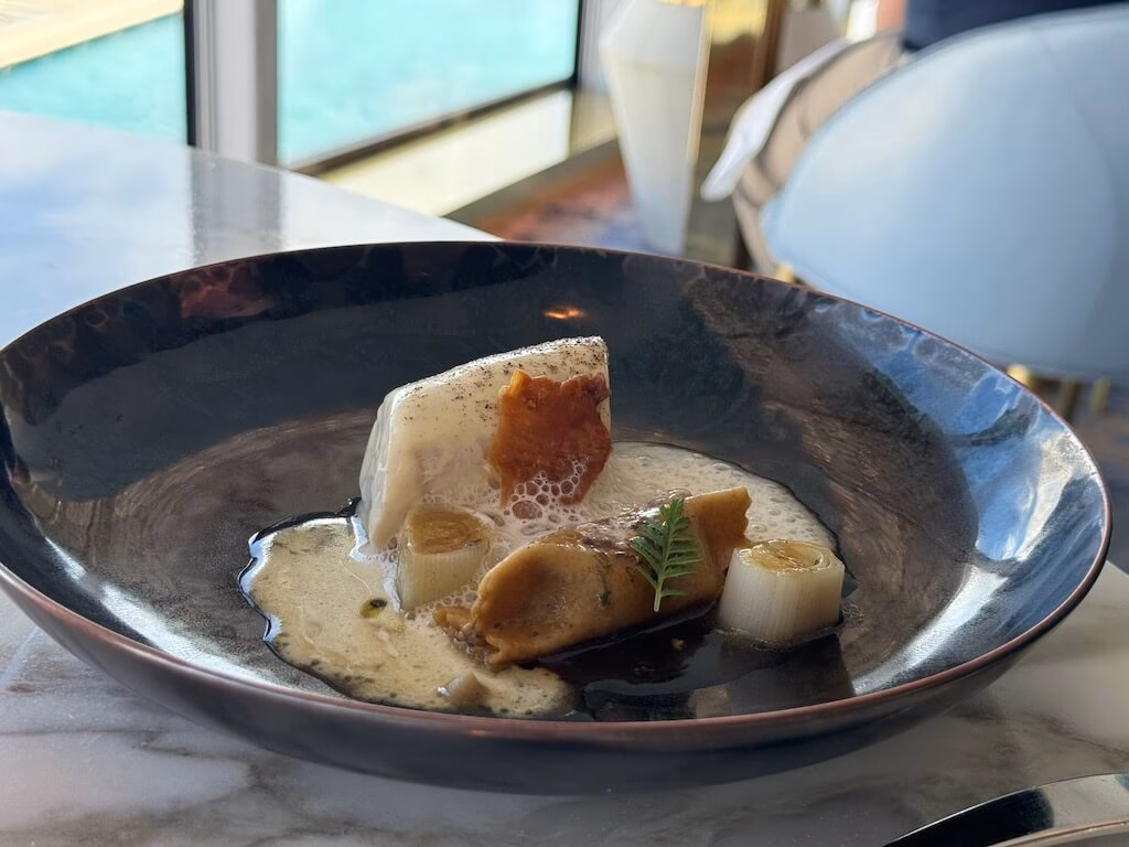 The chicken dish served as part of the course menu at Enchanté on the Disney Wish.