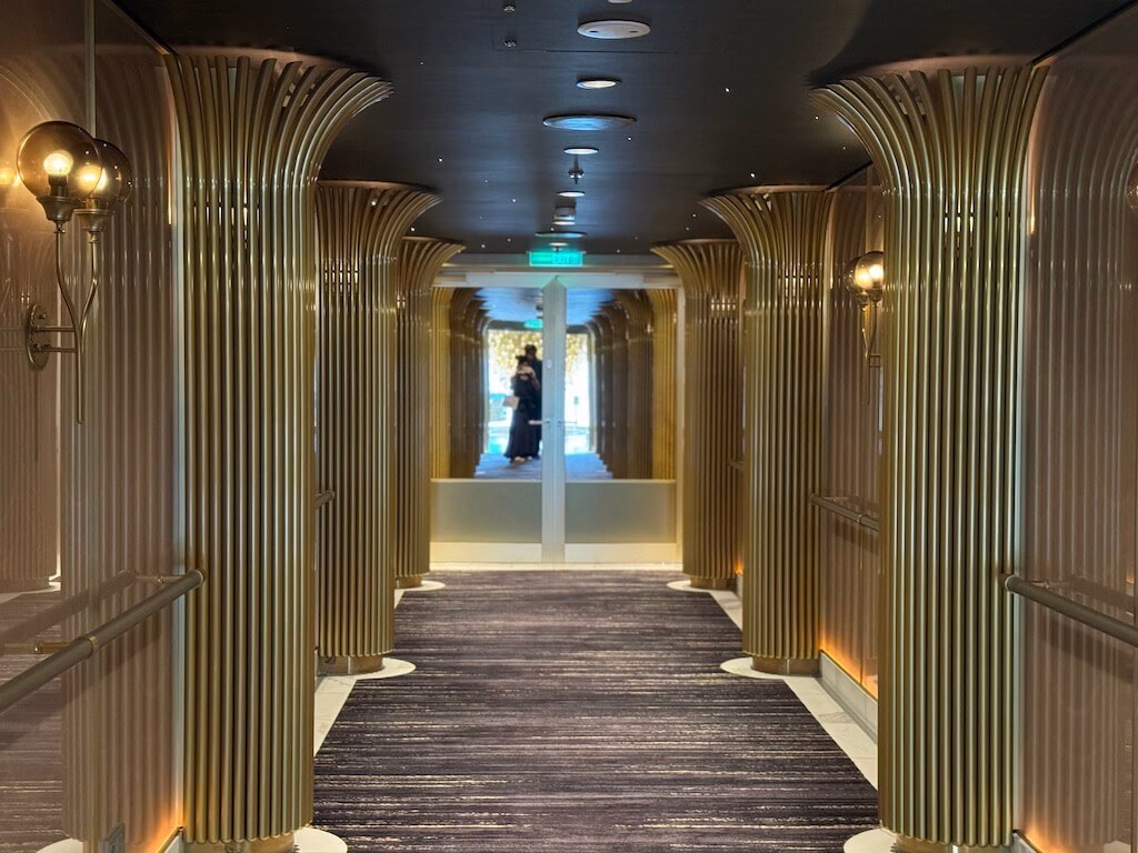 The lavish hallway leading to Enchanté restaurant on the Disney Wish