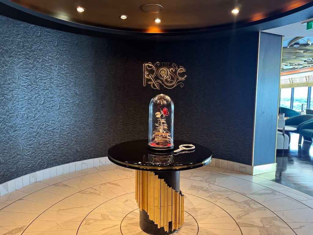 The Rose Lounge on the Disney Wish, where the enchanted rose from Beauty and the Beast is displayed.