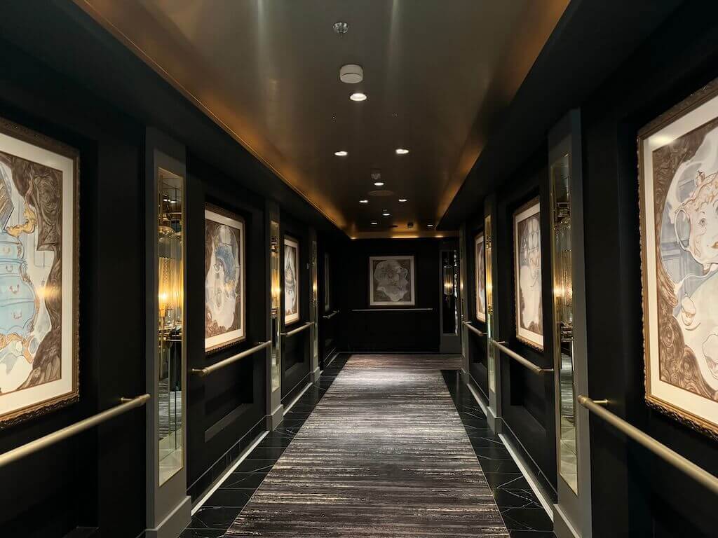DCL Wish Rose hallway - Tomo Travel & Camping he sleek, modern black hallway leading to the adults-only restaurants on the Disney Wish.