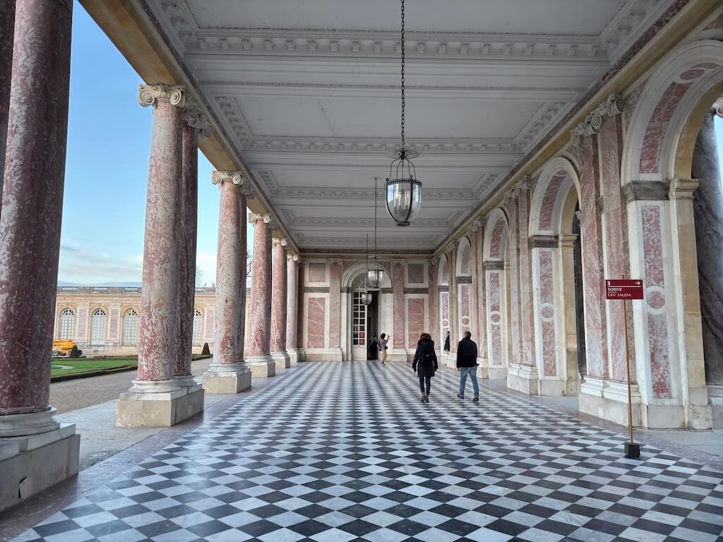 The Grand Trianon, located away from the main Versailles Palace, is a stunning retreat known for its signature pink marble columns.