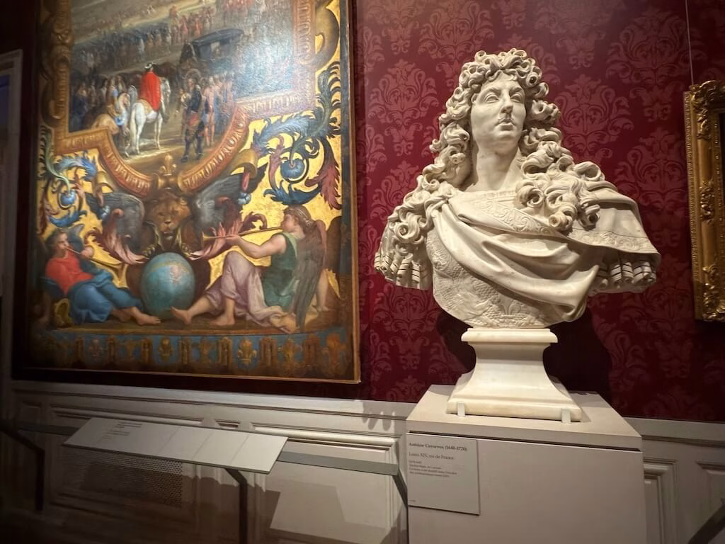 Inside the Palace of Versailles, a statue of Louis XIV stands proudly on display, capturing the regal presence of the Sun King.