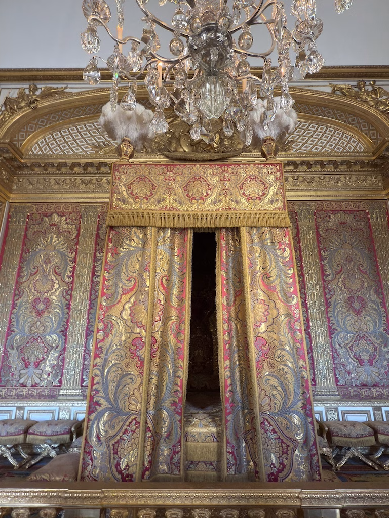 The King’s Bedroom in the Palace of Versailles was the setting for the elaborate Lever (waking) and Coucher (retiring) ceremonies, showcasing the ritualized daily life of French royalty.