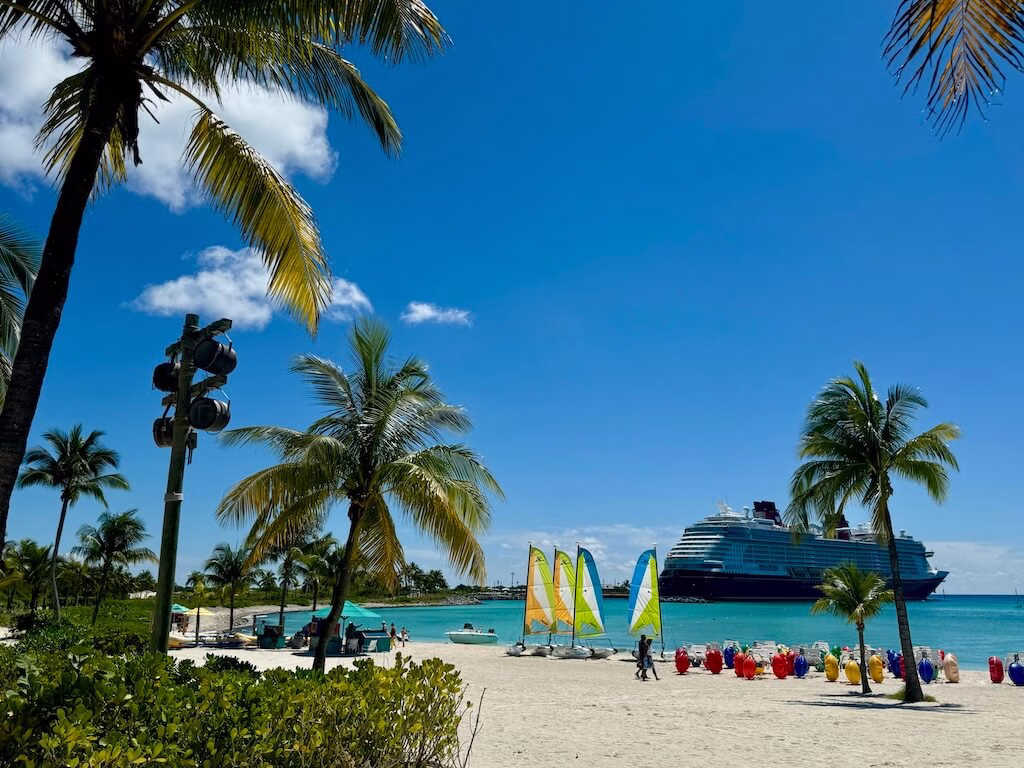 A view of the Disney Wish from Disney’s private island, Castaway Cay. Sharing the must-have essentials to bring on a Disney Cruise!