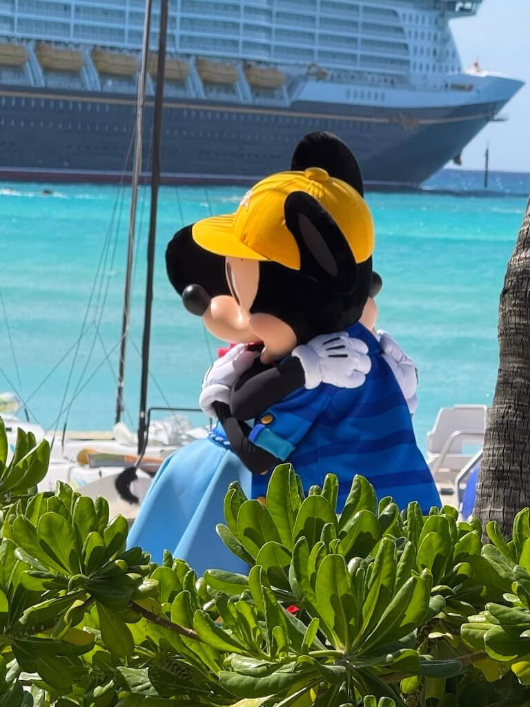 During character greetings on Castaway Cay, you might just catch a special moment when Mickey and Minnie switch places—don’t blink, or you’ll miss their sweet hug!