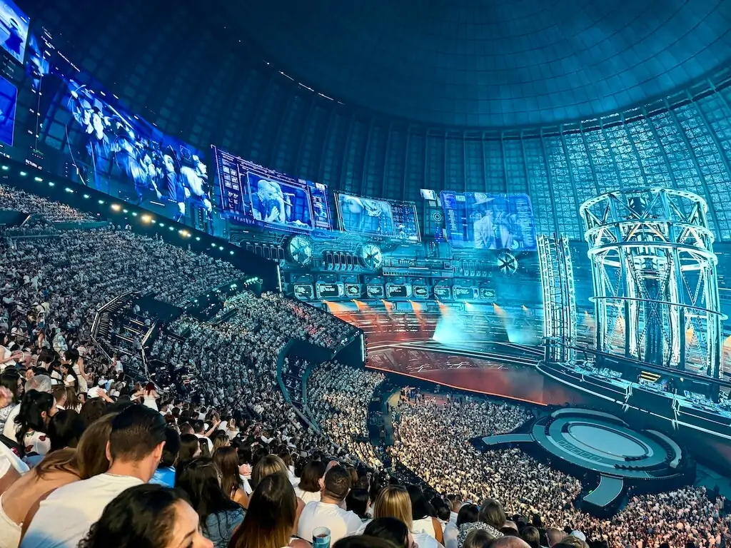 Crowd watching an immersive show inside the Sphere in Las Vegas, a family-friendly activity with stunning visuals and sound