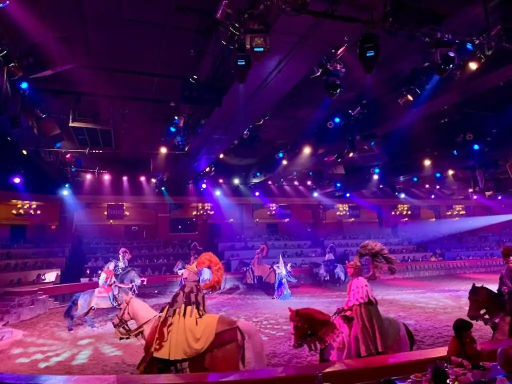 Colorful live performance at Tournament of Kings dinner show in Las Vegas, with knights on horseback entertaining families and kids