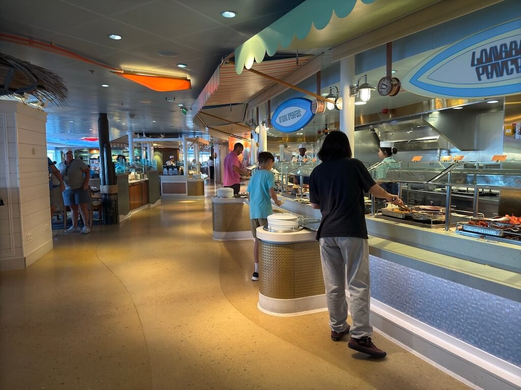 Guests enjoying breakfast at the Disney Cruise buffet on disembarkation morning before leaving the ship