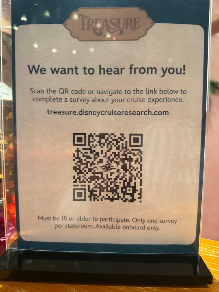 Disney Cruise Guest Feedback QR Code on the Final Night - Tomo Travel & Camping Disney Cruise Line guest feedback QR code displayed onboard on the final night